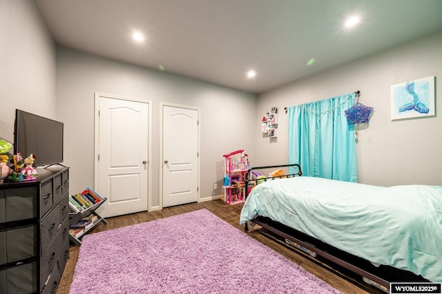 bedroom featuring wood finished floors and recessed lighting