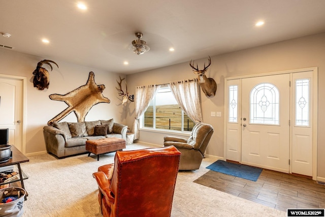 living area featuring a ceiling fan, baseboards, and recessed lighting