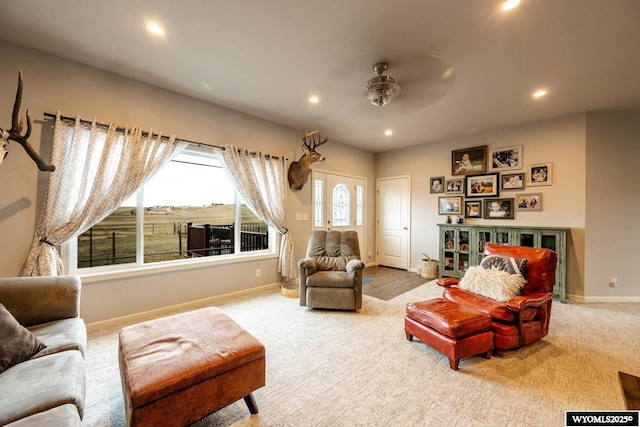 living room featuring carpet flooring, baseboards, ceiling fan, and recessed lighting