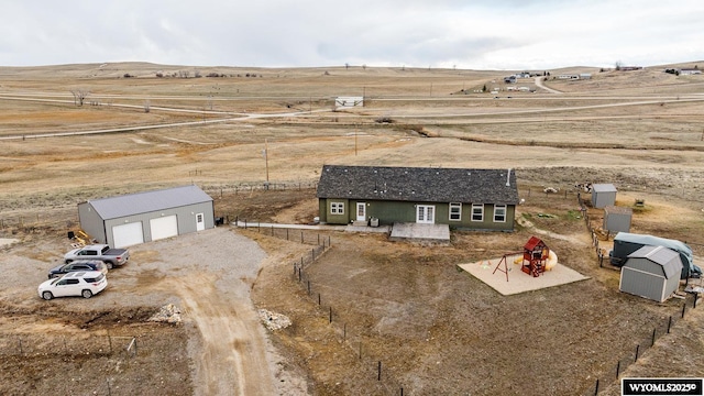 birds eye view of property featuring a rural view