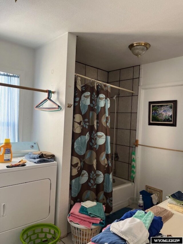 419 6th St, Rawlins, WY 82301 - full bathroom with shower / bath combo with shower curtain, washer / clothes dryer, and a textured ceiling