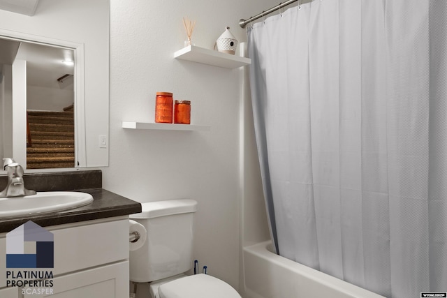 bathroom featuring toilet, vanity, and shower / tub combo with curtain