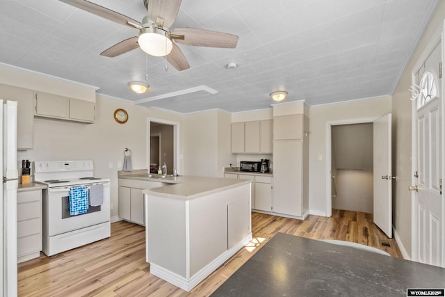 432 15th St, Evanston, WY 82930 - kitchen with white electric range, a peninsula, light wood-type flooring, ornamental molding, and a ceiling fan