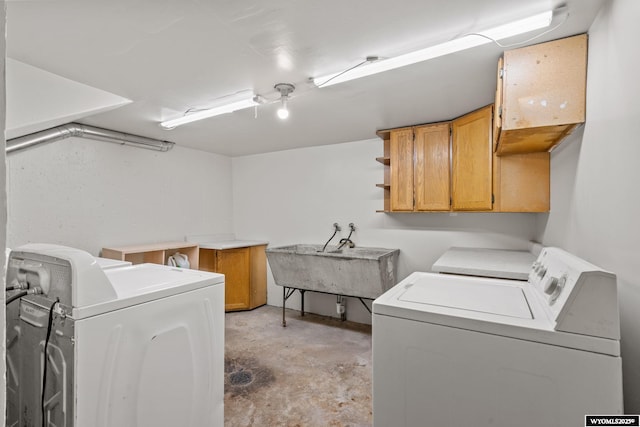 432 15th St, Evanston, WY 82930 - laundry area featuring washing machine and dryer and cabinet space