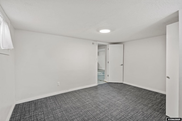 432 15th St, Evanston, WY 82930 - spare room featuring carpet flooring and a textured ceiling