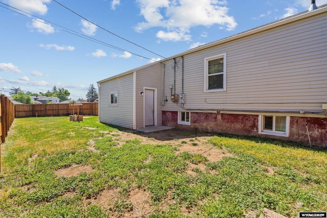 432 15th St, Evanston, WY 82930 - back of house with a fenced backyard