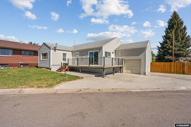 432 15th St, Evanston, WY 82930 - view of front of property featuring an attached garage, concrete driveway, and an outdoor structure