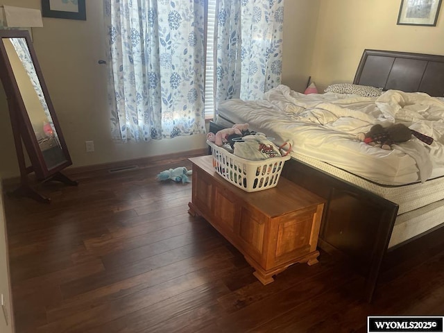 2720 State Highway 414 N, Lyman, WY 82937 - bedroom with dark wood-style floors