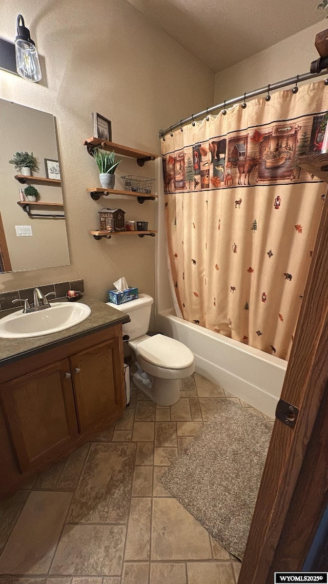 2720 State Highway 414 N, Lyman, WY 82937 - bathroom featuring toilet, stone finish flooring, shower / tub combo with curtain, and vanity
