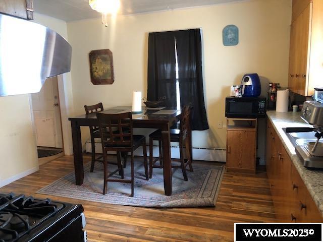 816 Center St, Rock Springs, WY 82901 - dining room with dark wood-style flooring