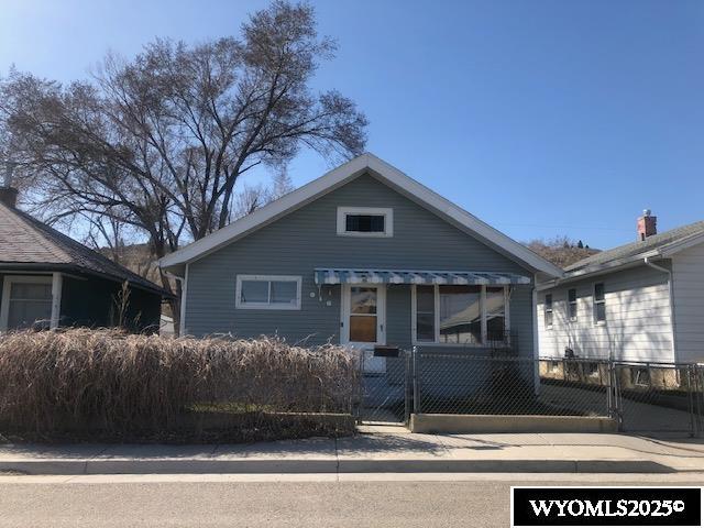 816 Center St, Rock Springs, WY 82901 - bungalow with a fenced front yard and a gate