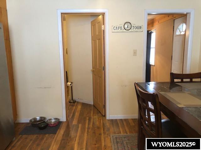 816 Center St, Rock Springs, WY 82901 - dining room featuring baseboards and wood finished floors
