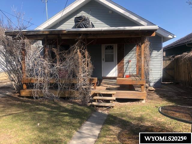 816 Center St, Rock Springs, WY 82901 - view of front of house with a front yard and fence