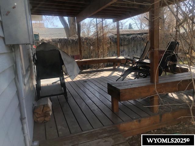 816 Center St, Rock Springs, WY 82901 - wooden terrace featuring fence