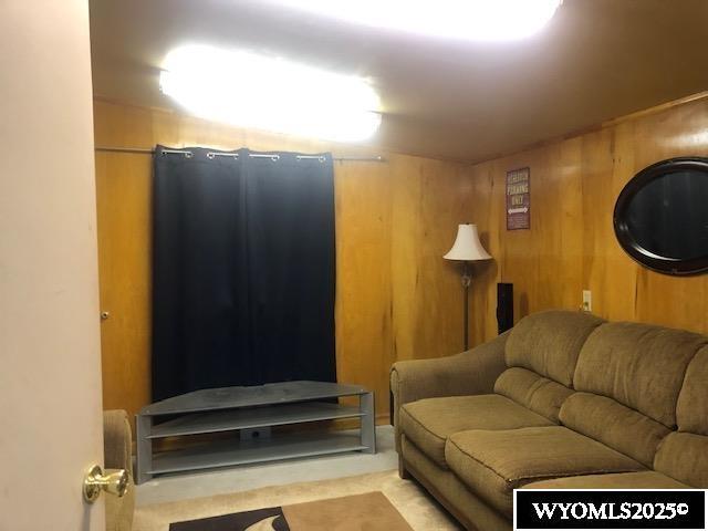 816 Center St, Rock Springs, WY 82901 - living room with wood walls