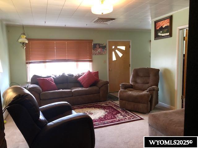 816 Center St, Rock Springs, WY 82901 - carpeted living room featuring visible vents