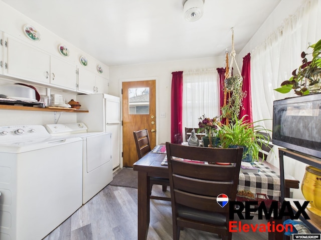 707 S 6th St, Basin, WY 82410 - dining area with washing machine and dryer and light wood-style floors