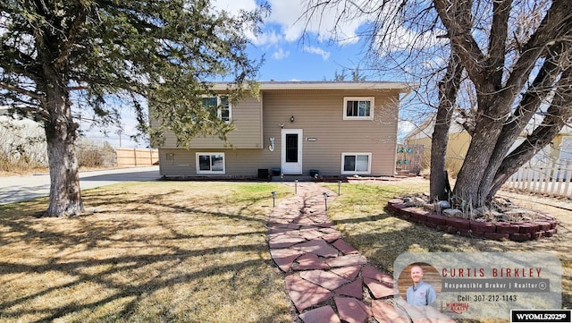 3617 Bighorn St, Torrington, WY 82240 - rear view of house featuring fence and a lawn