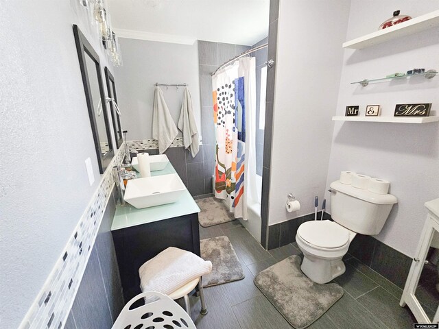 3617 Bighorn St, Torrington, WY 82240 - bathroom with toilet, crown molding, vanity, and shower / bath combination with curtain