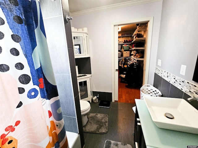 3617 Bighorn St, Torrington, WY 82240 - full bath with a shower with shower curtain, vanity, tile patterned floors, crown molding, and toilet