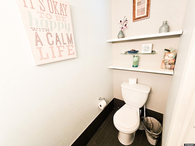 3617 Bighorn St, Torrington, WY 82240 - bathroom featuring baseboards and toilet