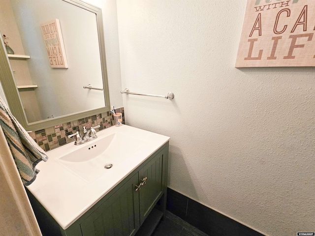 3617 Bighorn St, Torrington, WY 82240 - bathroom with tasteful backsplash, vanity, and a textured wall