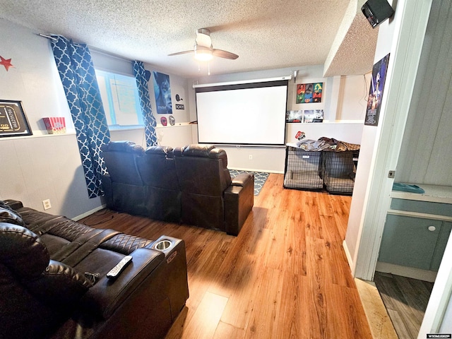 3617 Bighorn St, Torrington, WY 82240 - cinema featuring a textured ceiling, a ceiling fan, and wood finished floors