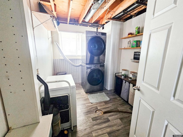 3617 Bighorn St, Torrington, WY 82240 - laundry room featuring stacked washer and dryer, laundry area, and wood finished floors