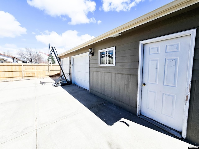 3617 Bighorn St, Torrington, WY 82240 - doorway to property with fence and a garage