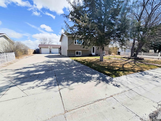 3617 Bighorn St, Torrington, WY 82240 - view of front of home with a detached garage and fence