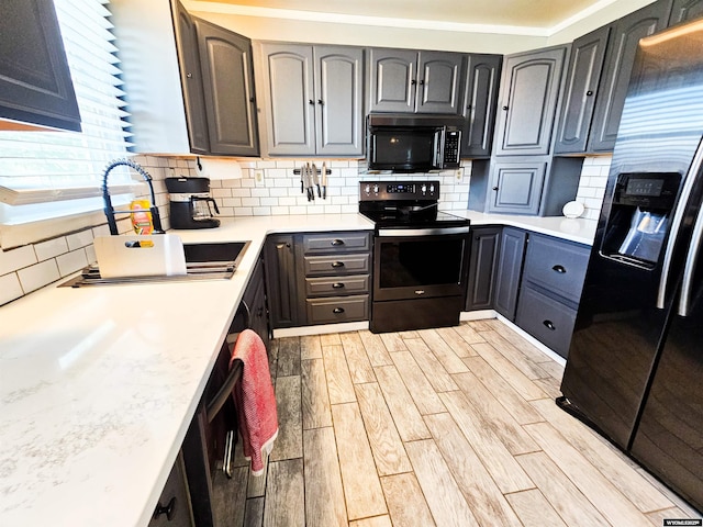 3617 Bighorn St, Torrington, WY 82240 - kitchen featuring electric range, refrigerator with ice dispenser, light countertops, wood tiled floor, and decorative backsplash