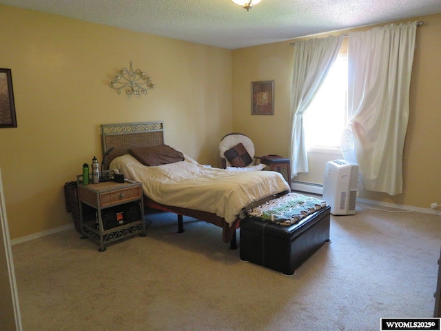 1001 Cheshire St, Casper, WY 82609 - bedroom with carpet, a baseboard heating unit, baseboards, and a textured ceiling