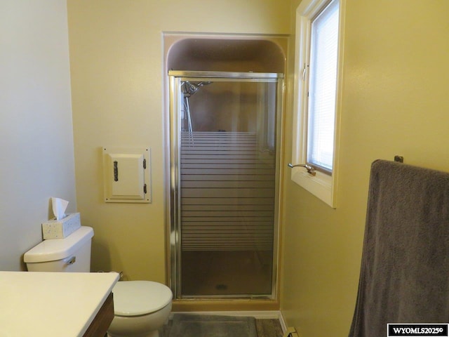 1001 Cheshire St, Casper, WY 82609 - full bathroom with a shower stall, vanity, and toilet