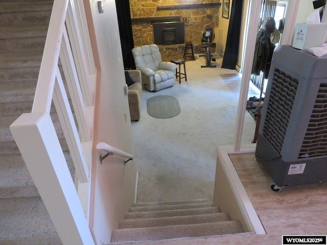 1001 Cheshire St, Casper, WY 82609 - stairway featuring a wood stove and carpet
