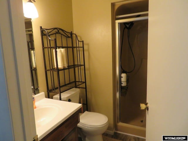 1001 Cheshire St, Casper, WY 82609 - bathroom with toilet, a stall shower, and vanity