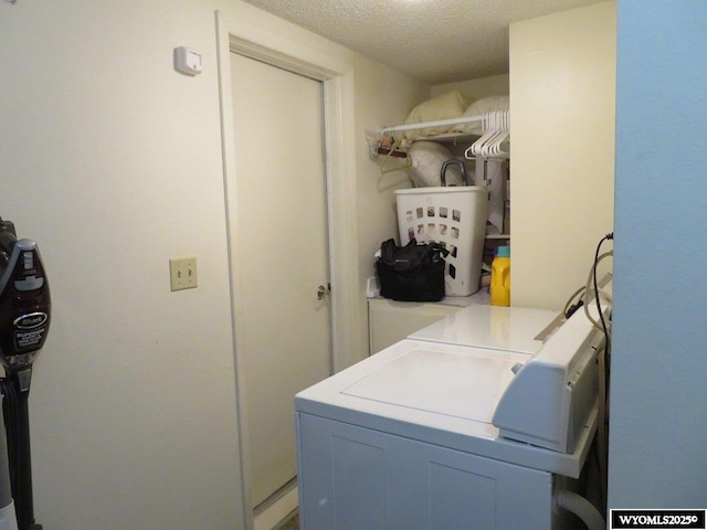 1001 Cheshire St, Casper, WY 82609 - clothes washing area with laundry area, a textured ceiling, and washer and clothes dryer