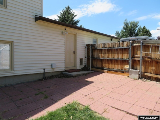 1001 Cheshire St, Casper, WY 82609 - view of patio with fence and a gate