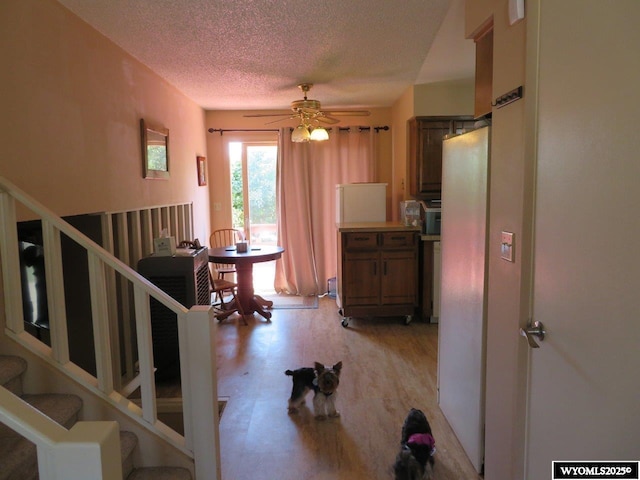 1001 Cheshire St, Casper, WY 82609 - interior space with a textured ceiling, stairway, and light wood-style floors