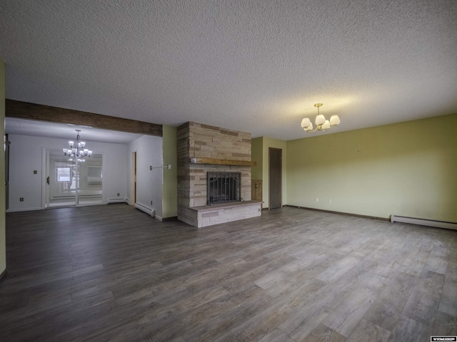unfurnished living room with a chandelier, a fireplace, dark wood-type flooring, and a baseboard radiator