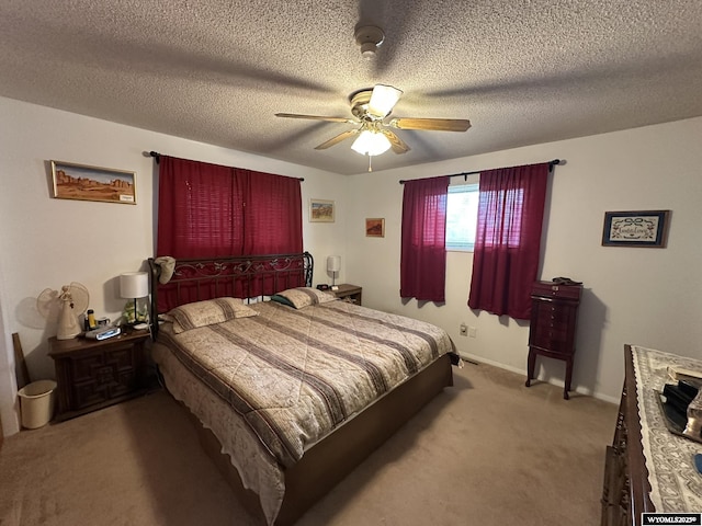 341 E 29th Ave, Torrington, WY 82240 - bedroom featuring a textured ceiling, carpet flooring, and a ceiling fan