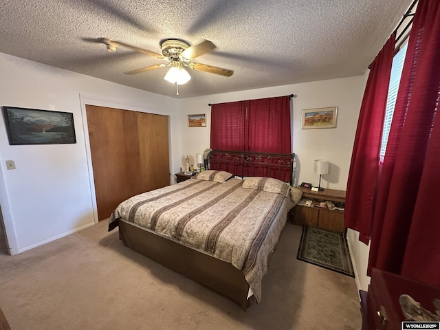 341 E 29th Ave, Torrington, WY 82240 - carpeted bedroom with a textured ceiling, a closet, baseboards, and a ceiling fan