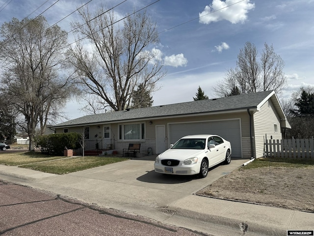 341 E 29th Ave, Torrington, WY 82240 - single story home with a garage, driveway, and fence