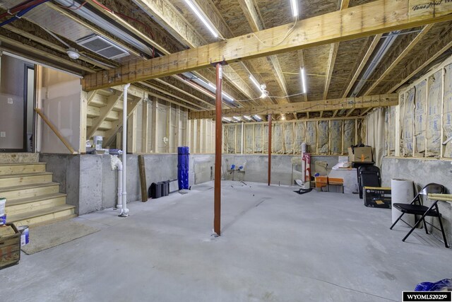 unfinished basement with stairs