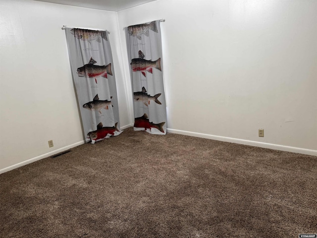 unfurnished bedroom featuring carpet floors, baseboards, and visible vents