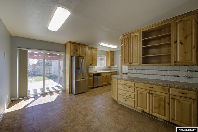 kitchen featuring tasteful backsplash, open shelves, a sink, appliances with stainless steel finishes, and light brown cabinetry