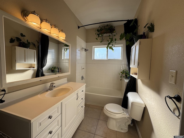 410 E Monroe Ave, Riverton, WY 82501 - bathroom featuring vanity, a textured wall, shower / bath combination, tile patterned flooring, and toilet