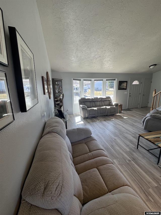 325 Hathaway Ave, Evanston, WY 82930 - living area featuring a textured ceiling and wood finished floors