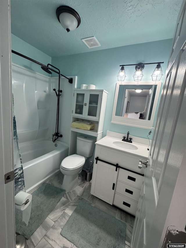 325 Hathaway Ave, Evanston, WY 82930 - bathroom with a textured ceiling, vanity, visible vents, toilet, and marble finish floor