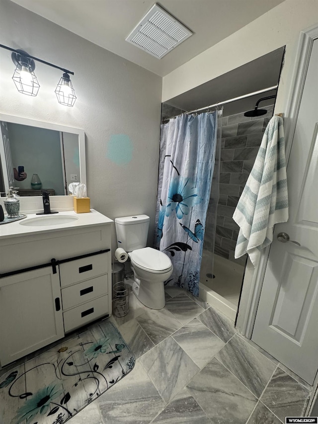 325 Hathaway Ave, Evanston, WY 82930 - bathroom featuring a shower stall, vanity, visible vents, and toilet