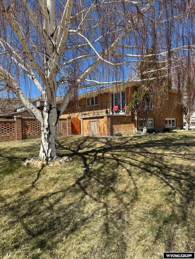 back of property with a yard